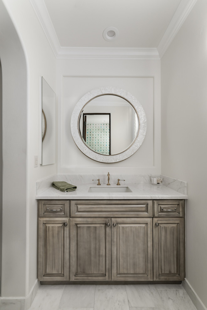 Inspiration for an expansive country master bathroom in Phoenix with furniture-like cabinets, brown cabinets, a freestanding tub, an alcove shower, a one-piece toilet, multi-coloured tile, marble, white walls, marble floors, a vessel sink, marble benchtops, white floor, a hinged shower door and multi-coloured benchtops.