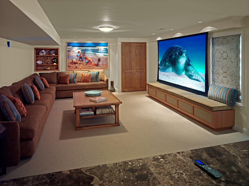 Photo of a mid-sized beach style enclosed home theatre in Seattle with beige walls, carpet, a wall-mounted tv and beige floor.