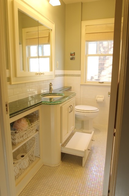 Mid-sized contemporary kids bathroom in Minneapolis with flat-panel cabinets, white cabinets, an alcove tub, a two-piece toilet, multi-coloured tile, ceramic tile, grey walls, ceramic floors, an undermount sink and glass benchtops.