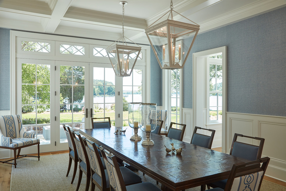 This is an example of a beach style separate dining room in Baltimore with blue walls.