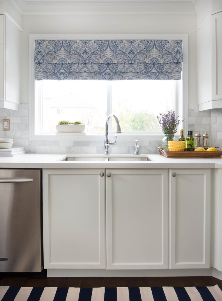 Example of a transitional kitchen design in Toronto