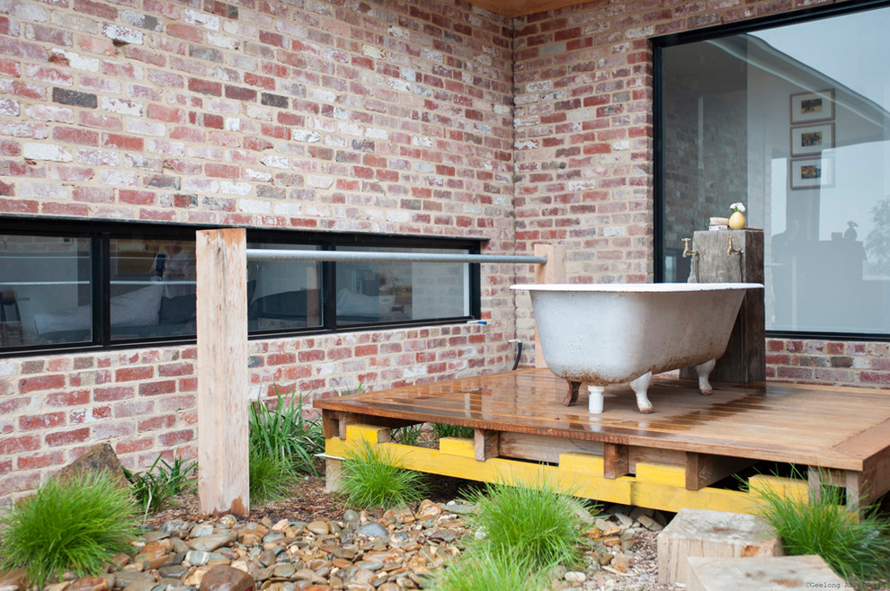This is an example of a contemporary bathroom in Melbourne with a claw-foot tub.