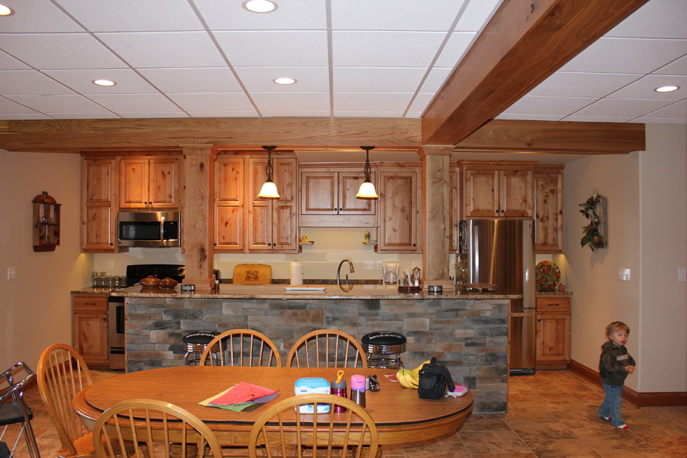 Kitchen - mid-sized rustic walk-out ceramic tile and brown floor kitchen idea in Chicago with beige walls, a standard fireplace and a stone fireplace