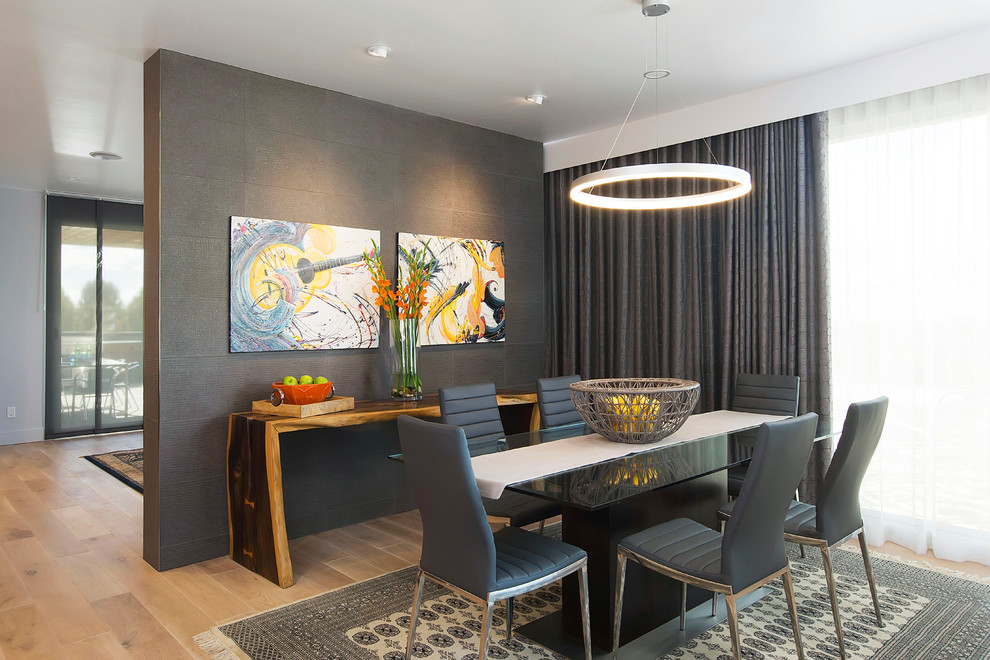Dining room - contemporary light wood floor dining room idea in Phoenix with black walls