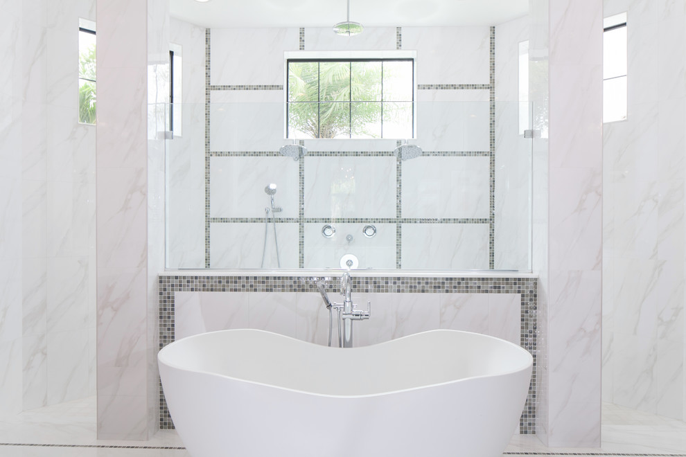 Example of a large transitional master white tile and marble tile marble floor and white floor freestanding bathtub design in Miami with dark wood cabinets and white walls