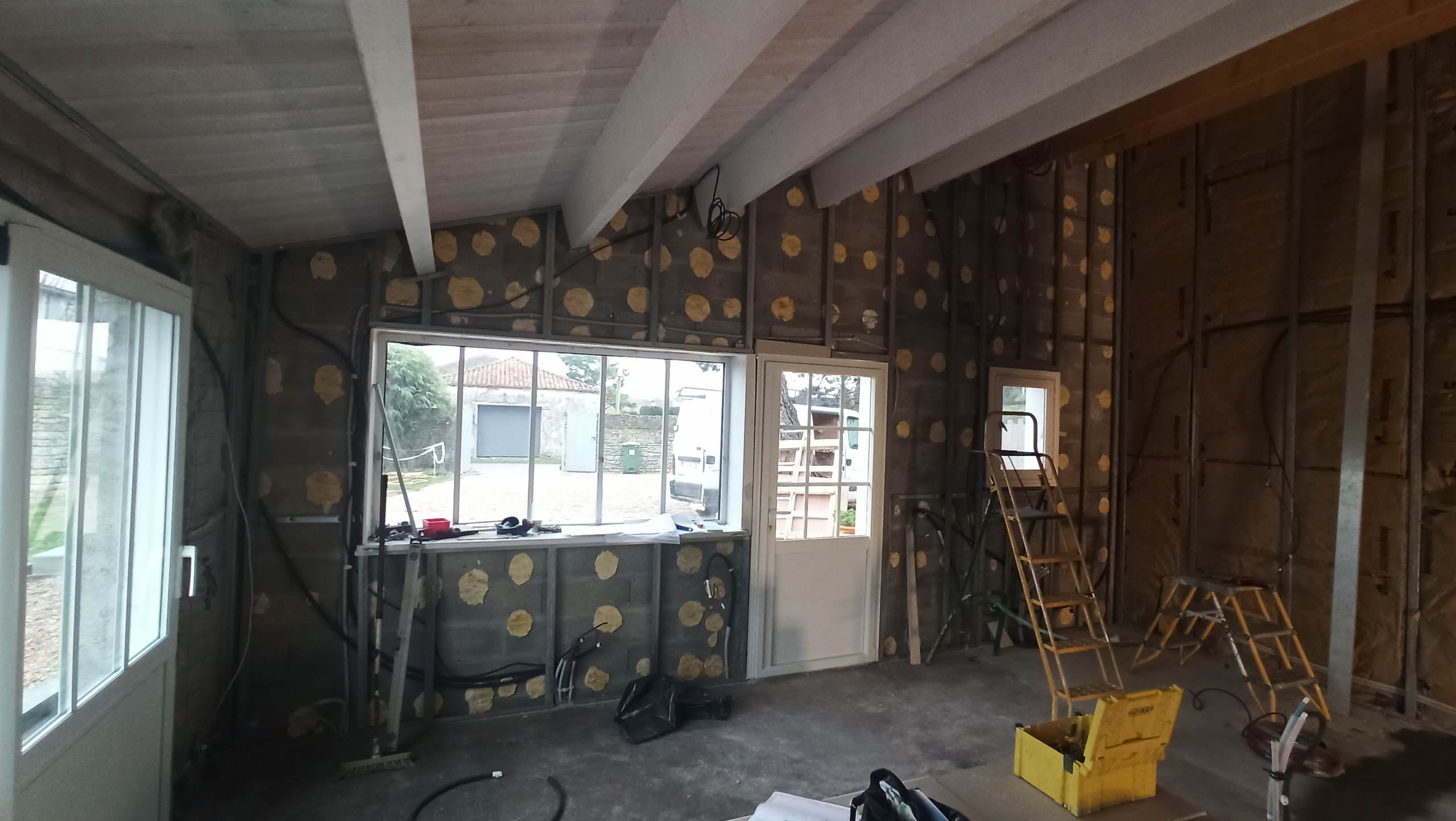 Transformation d'une chambre parentale en pièce de vie/cuisine