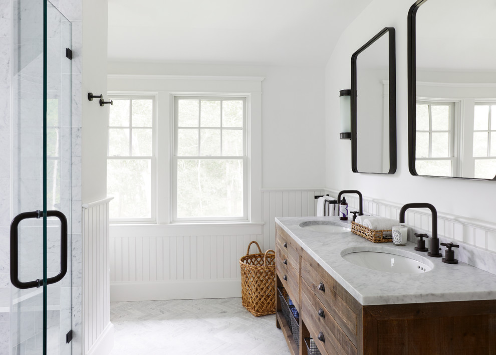 Inspiration for a mid-sized contemporary master bathroom in New York with medium wood cabinets, white tile, stone tile, white walls, marble floors, a console sink and marble benchtops.