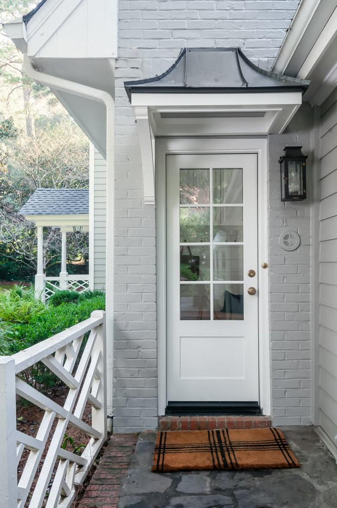 Design ideas for a small traditional single-wall utility room in Atlanta with a single-bowl sink, shaker cabinets, white cabinets and grey walls.