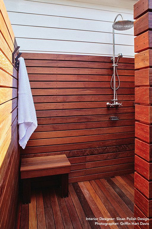 This is an example of a modern rooftop and rooftop deck in Raleigh with an outdoor shower and a pergola.