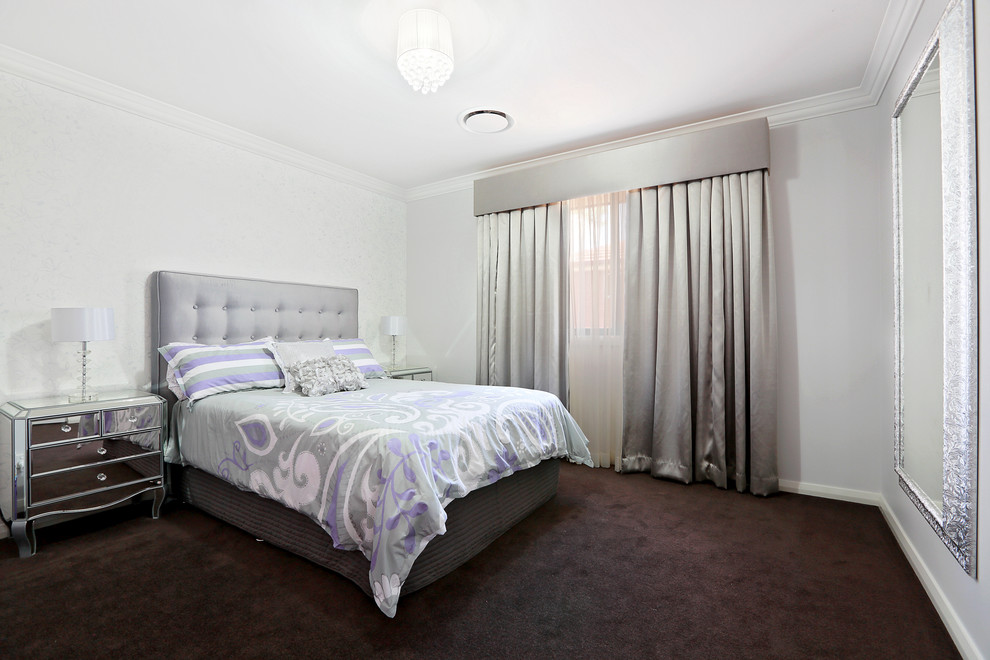 Inspiration for a large contemporary guest bedroom in Sydney with white walls and carpet.