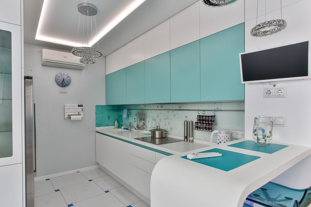 This is an example of a mid-sized contemporary u-shaped kitchen in Moscow with an integrated sink, flat-panel cabinets, white cabinets, glass benchtops, glass sheet splashback, porcelain floors, a peninsula, multi-coloured floor and white benchtop.