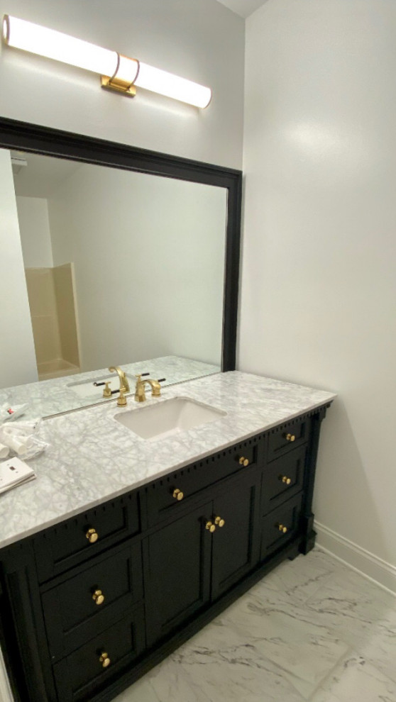 Photo of a mid-sized transitional 3/4 bathroom in Other with furniture-like cabinets, black cabinets, an alcove tub, a shower/bathtub combo, a one-piece toilet, grey walls, marble floors, an undermount sink, marble benchtops, multi-coloured floor, a hinged shower door, multi-coloured benchtops, a single vanity and a freestanding vanity.