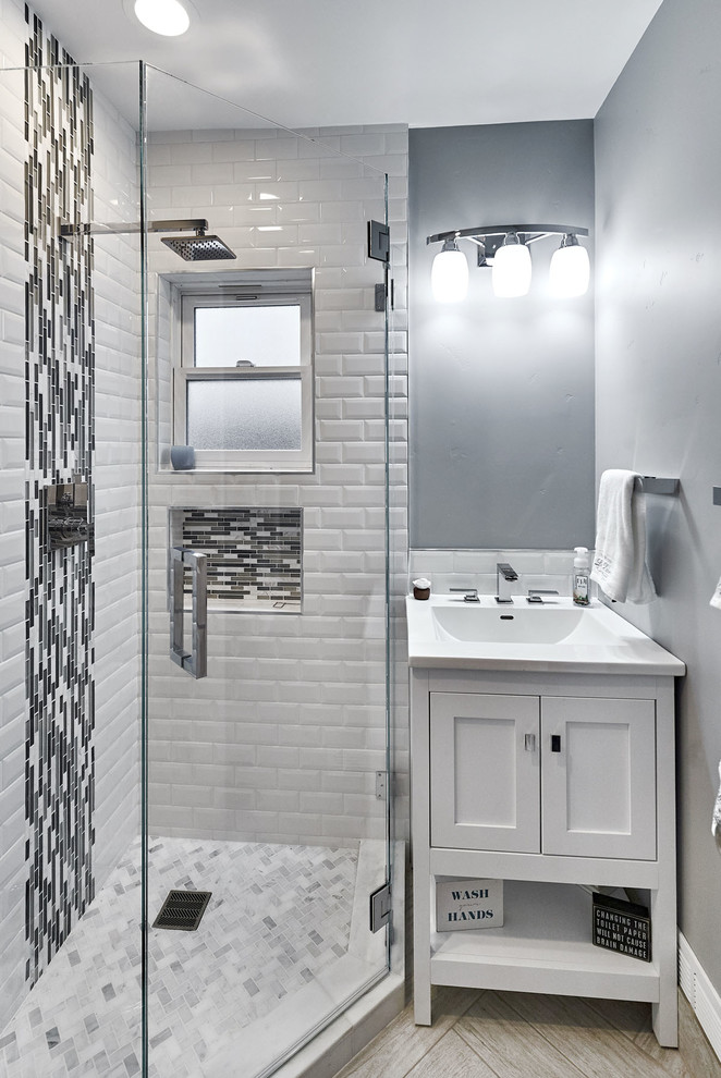 Small contemporary 3/4 bathroom in San Francisco with furniture-like cabinets, white cabinets, a corner shower, a two-piece toilet, gray tile, ceramic tile, grey walls, porcelain floors, an undermount sink, engineered quartz benchtops, grey floor and a hinged shower door.