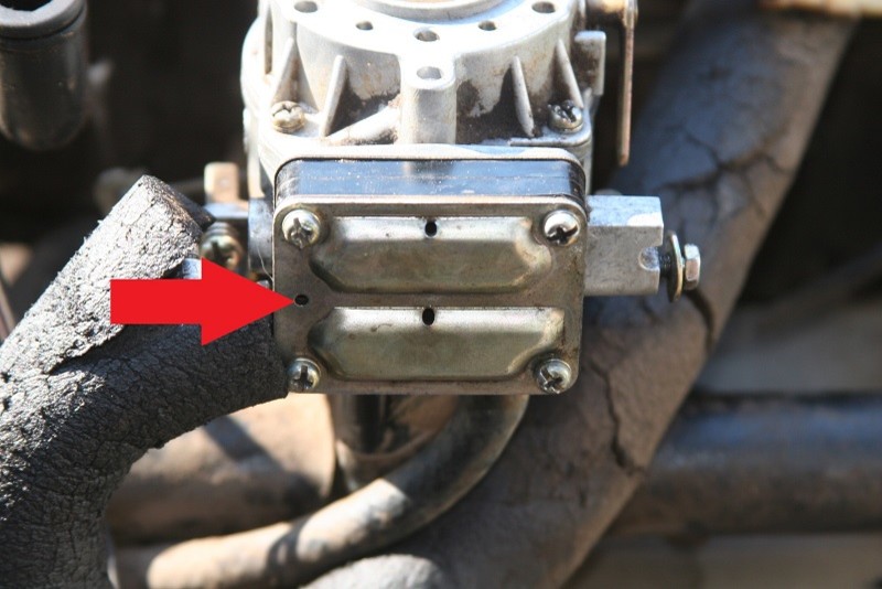 Gas Spitting out of carb on Lawmower