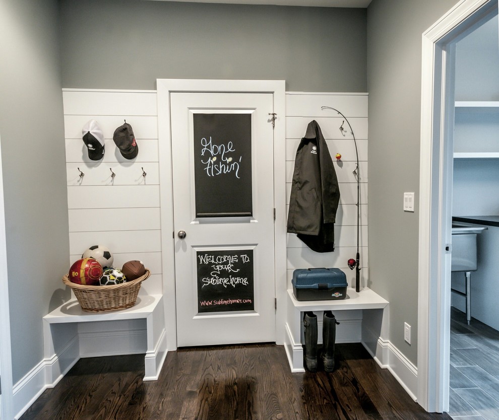 Inspiration for a transitional dark wood floor mudroom remodel in Chicago with gray walls and a white front door