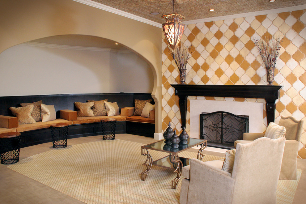 This is an example of a mediterranean basement in Cleveland with beige walls, carpet, a standard fireplace, a tile fireplace surround and beige floor.