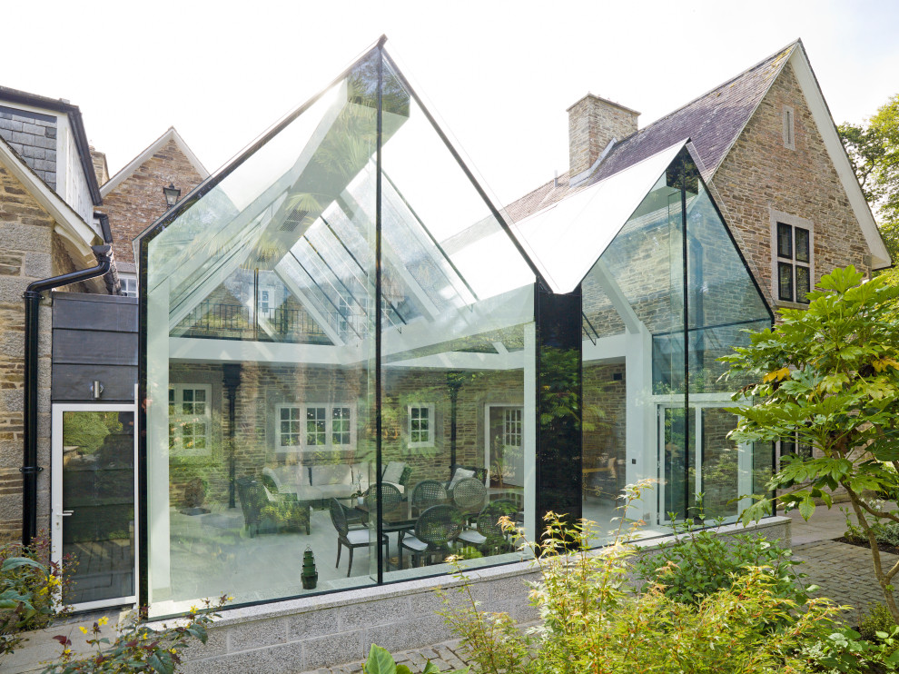 Inspiration for a large contemporary conservatory in Cornwall with limestone flooring, a glass ceiling and beige floors.