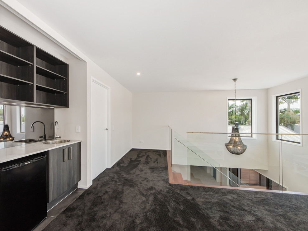 Inspiration for a small modern open plan kitchen in Gold Coast - Tweed with dark wood cabinets, granite benchtops, grey splashback, glass sheet splashback, no island, grey floor and white benchtop.