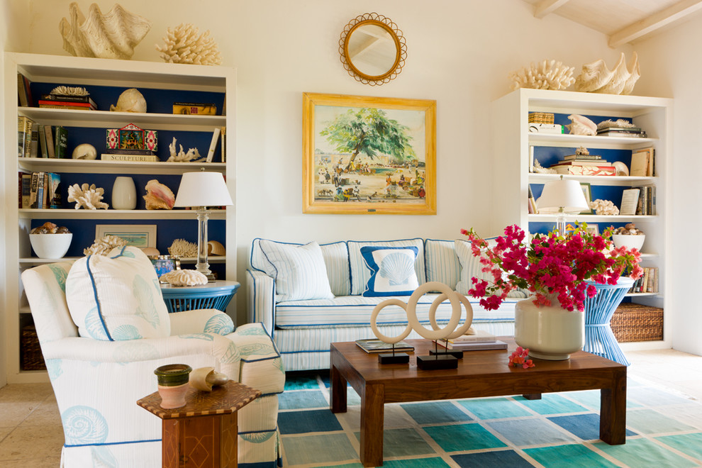 Example of an island style family room design in Boston with white walls
