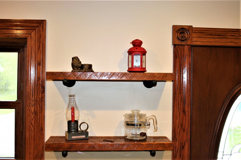 Eat-in kitchen - mid-sized rustic l-shaped vinyl floor and beige floor eat-in kitchen idea with a farmhouse sink, raised-panel cabinets, medium tone wood cabinets, laminate countertops, beige backsplash, cement tile backsplash, stainless steel appliances, a peninsula and beige countertops