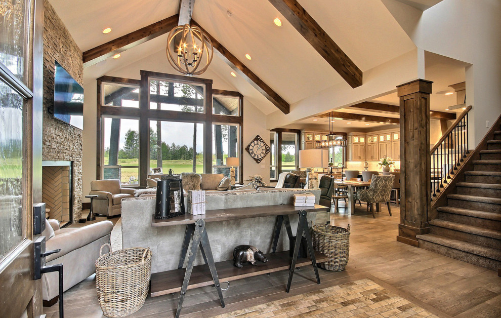 Inspiration for a huge craftsman concrete floor, beige floor, vaulted ceiling and wall paneling entryway remodel in Portland with beige walls and a dark wood front door