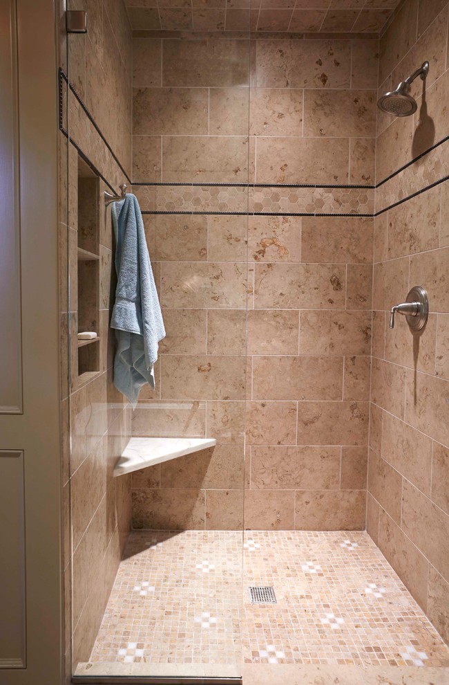 Photo of a large transitional bathroom in Birmingham with an alcove shower, beige tile and stone tile.