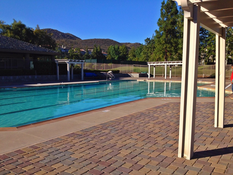 Tuscan concrete paver pool photo in Orange County