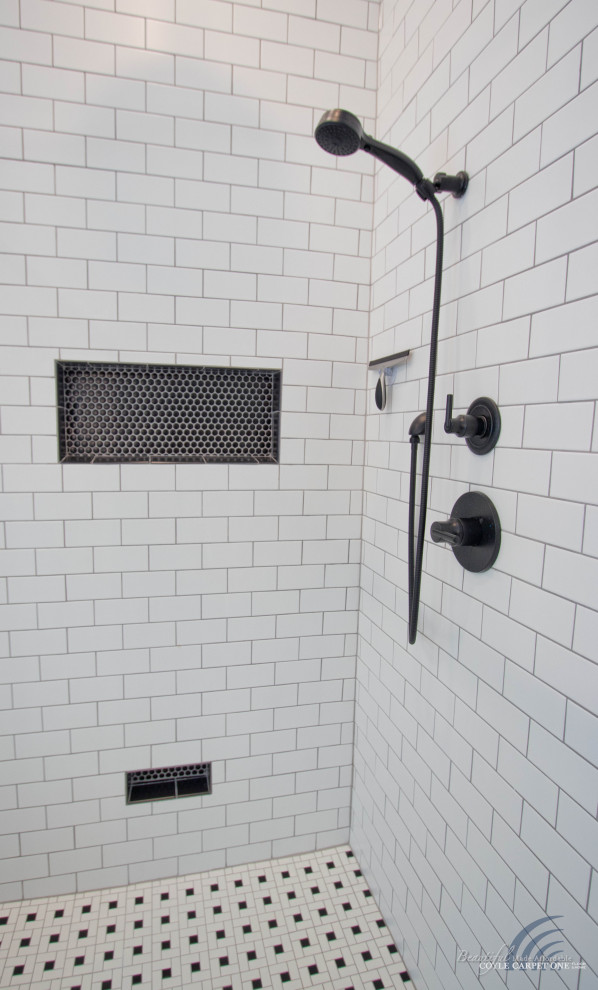 This is an example of a large transitional master bathroom in Other with a corner shower, white tile, subway tile, mosaic tile floors, white floor and a niche.