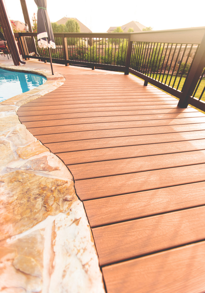 Small backyard ground level mixed material railing deck photo