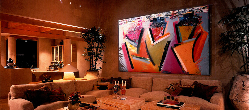 Inspiration for a large open concept living room in Los Angeles with orange walls, terra-cotta floors and no fireplace.