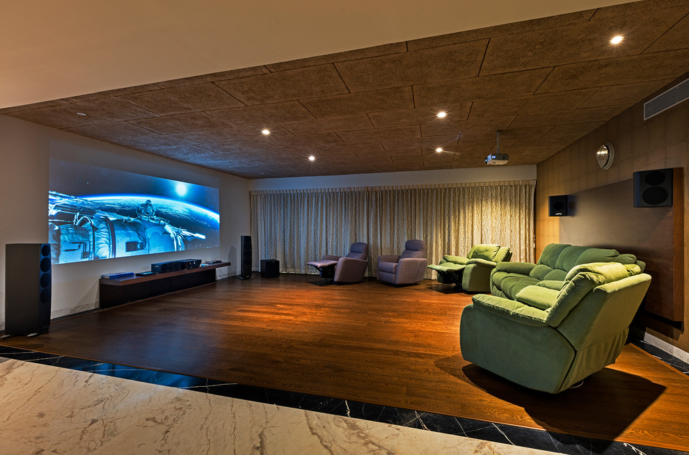 Inspiration for a contemporary home theatre in Bengaluru.