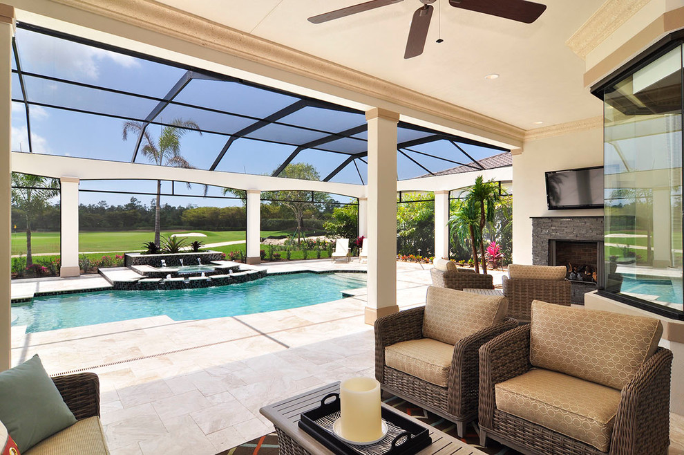 Traditional patio in Miami with a fire feature and a roof extension.