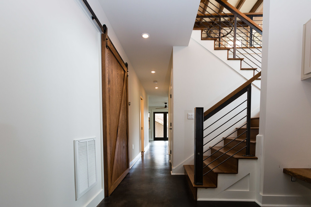 Hallway - mid-sized concrete floor hallway idea with white walls