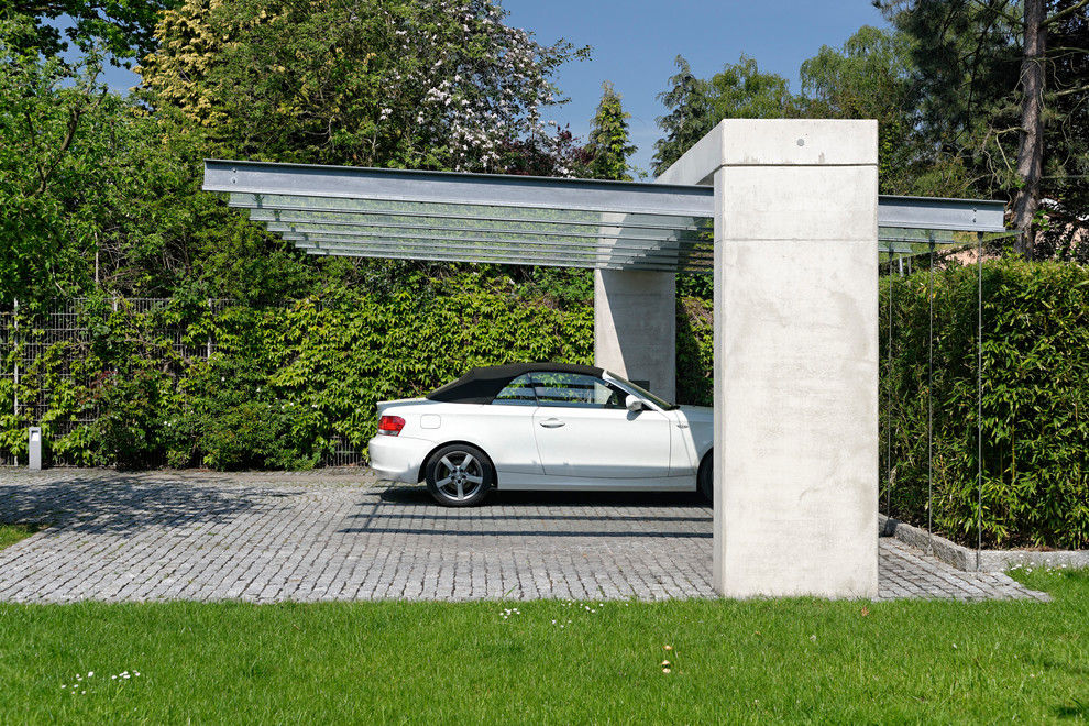 This is an example of a mid-sized contemporary detached two-car carport in Stuttgart.