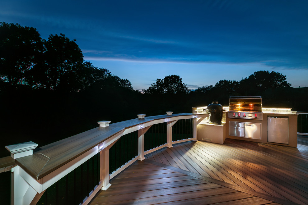Photo of a mid-sized transitional deck in Charlotte with an outdoor kitchen.