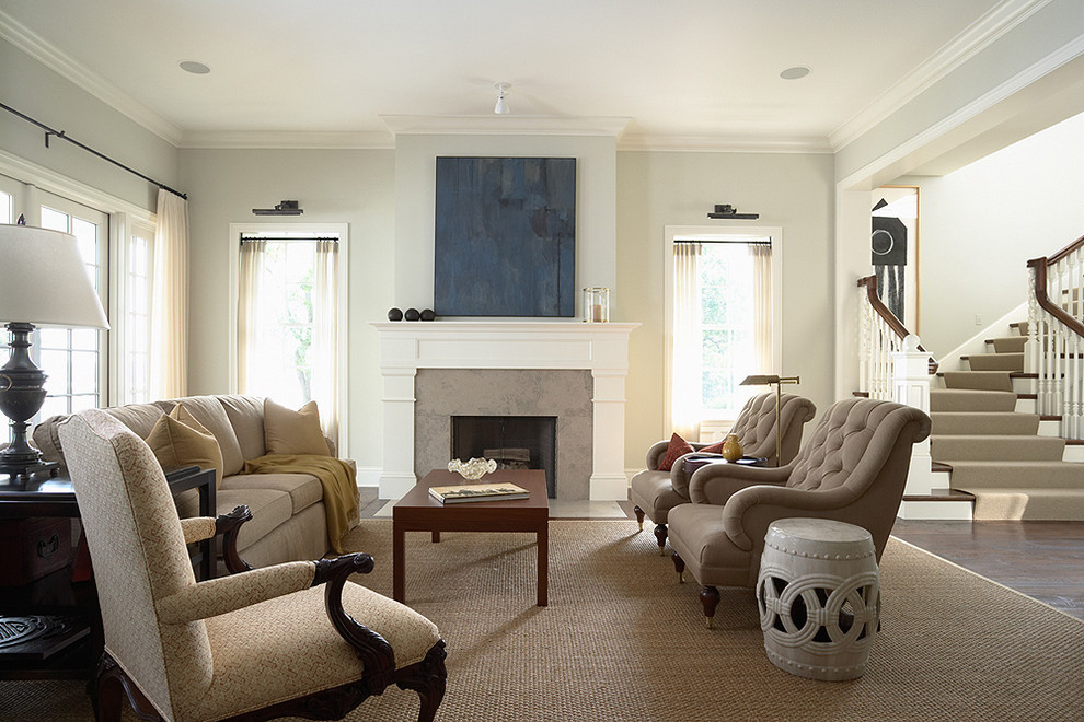 Traditional living room in Minneapolis with dark hardwood floors and a standard fireplace.
