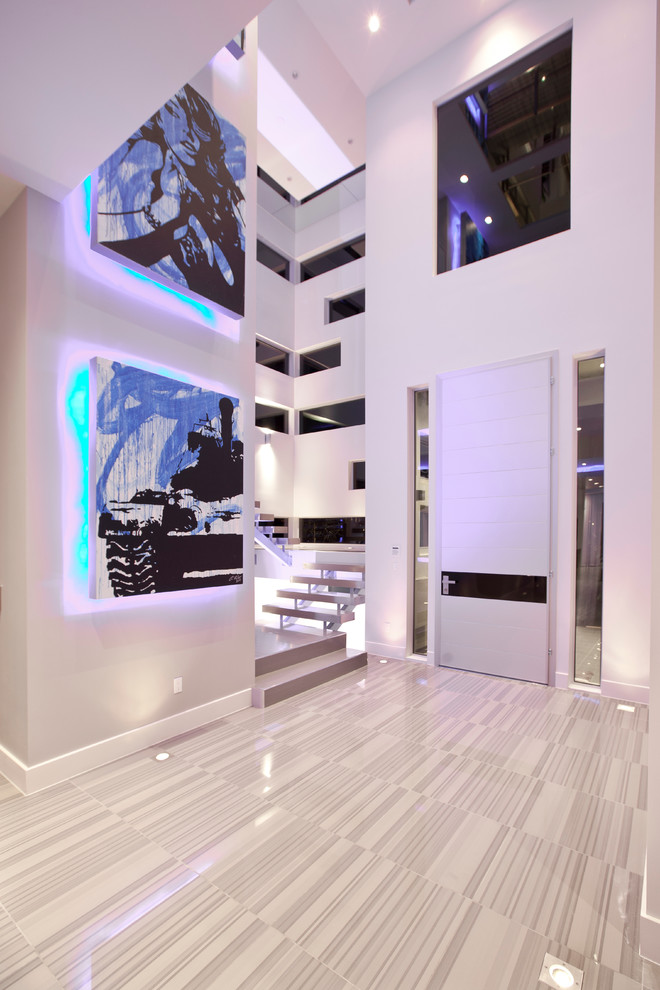 Photo of a contemporary foyer in Las Vegas with a single front door and a white front door.