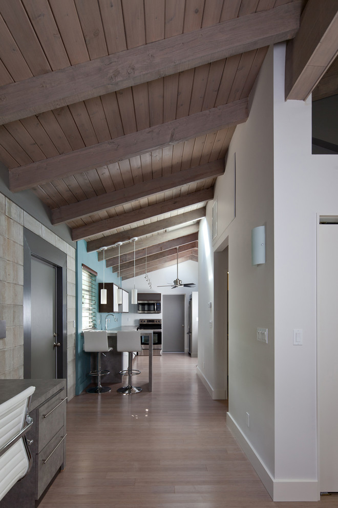 Contemporary entry hall in Other with white walls.