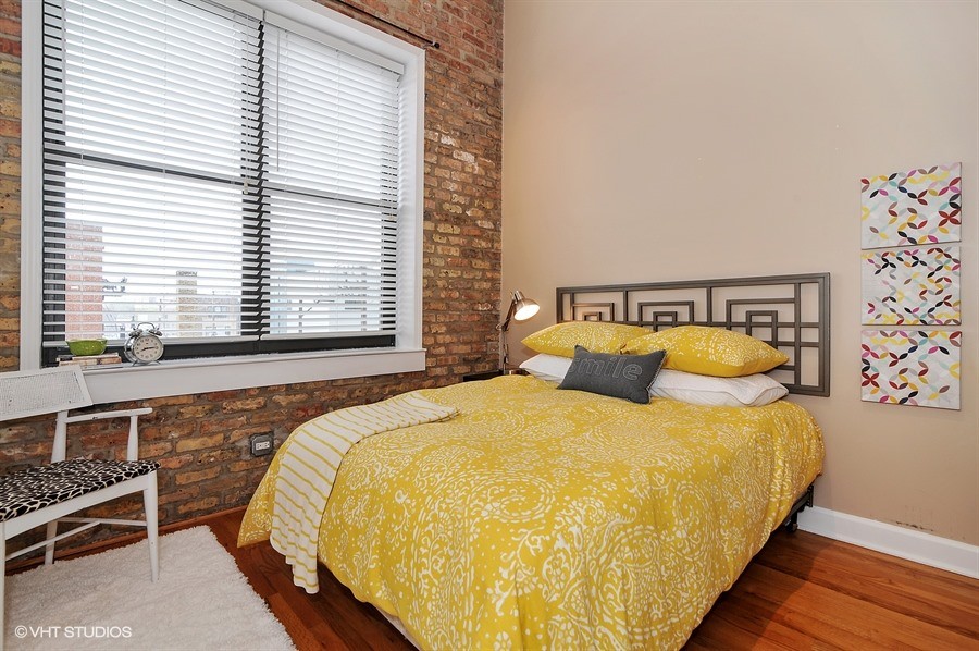 Inspiration for a mid-sized transitional master light wood floor bedroom remodel in Chicago with green walls