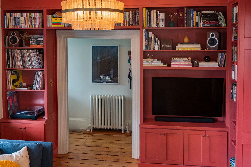 Example of a trendy enclosed medium tone wood floor family room library design in Philadelphia with no fireplace and no tv