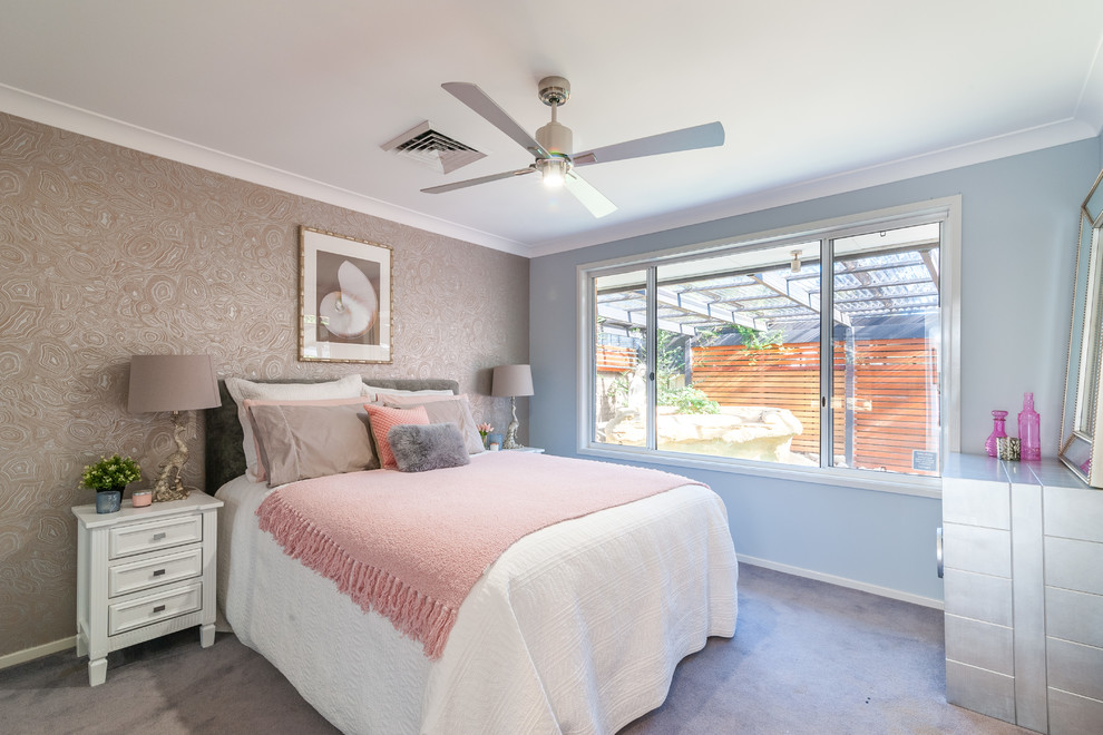 Transitional bedroom in Sydney with blue walls, carpet and beige floor.