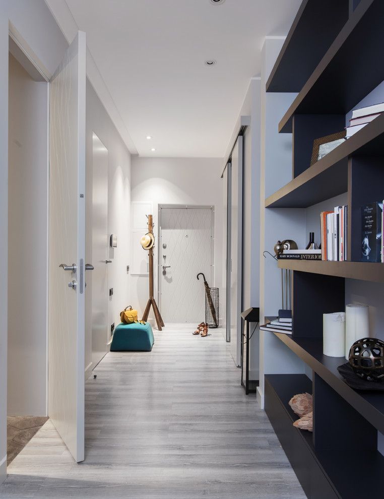 Design ideas for a mid-sized contemporary hallway in Moscow with grey walls, cork floors and grey floor.