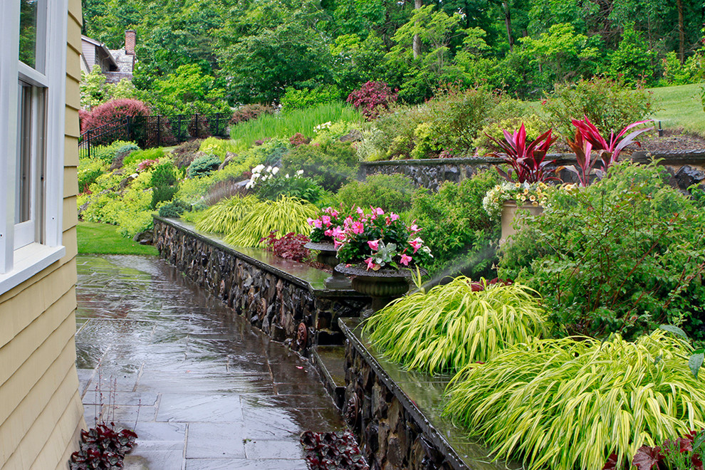 Inspiration for a large victorian full sun backyard concrete paver formal garden in New York for winter.