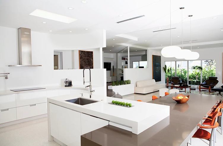 Large modern u-shaped separate kitchen in San Diego with an undermount sink, flat-panel cabinets, white cabinets, with island, quartzite benchtops, stainless steel appliances and beige floor.