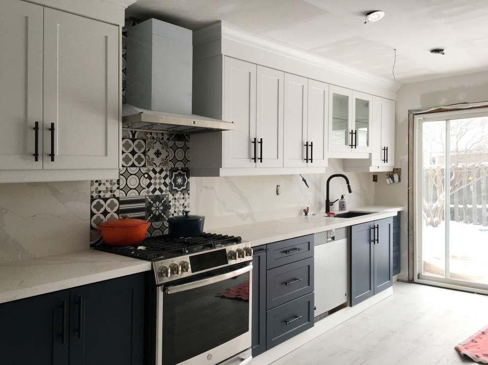 Example of a transitional kitchen design in Toronto