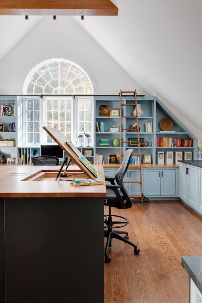 Example of a transitional home office design in Boston