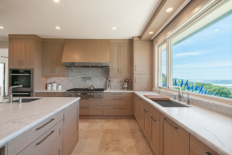 Small transitional u-shaped kitchen pantry in San Francisco with a single-bowl sink, shaker cabinets, light wood cabinets, granite benchtops, grey splashback, cement tile splashback, stainless steel appliances, ceramic floors, with island and beige floor.