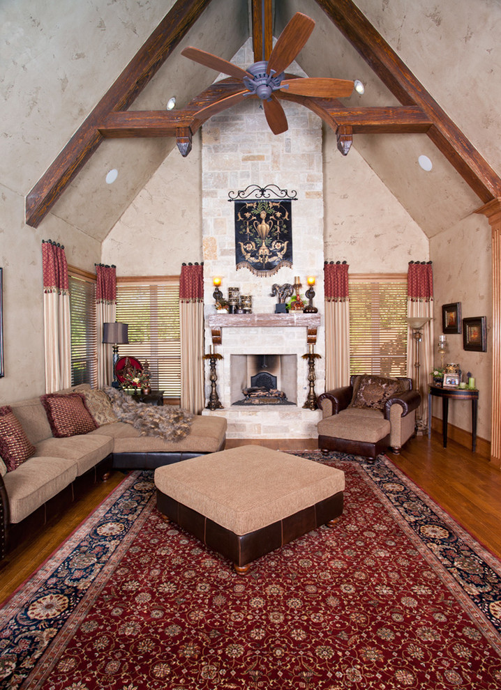 This is an example of a transitional living room in Dallas with a standard fireplace and a brick fireplace surround.