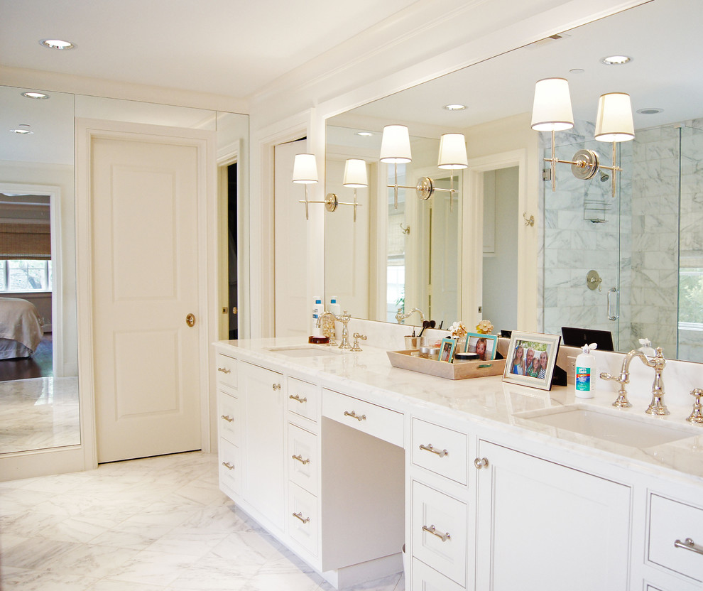 This is an example of a traditional bathroom in Dallas with marble benchtops, marble floors and marble.