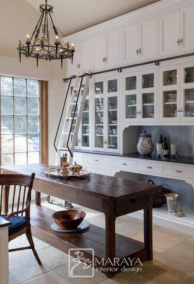 Expansive traditional kitchen pantry in Santa Barbara with a farmhouse sink, recessed-panel cabinets, white cabinets, quartz benchtops, timber splashback, slate floors, with island, green floor and black benchtop.